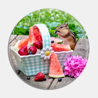Chipmunk enjoys eating a basket of fruit Pin