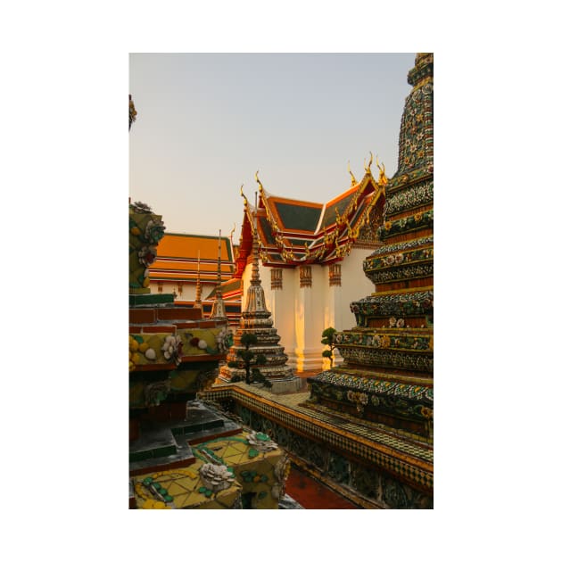 Fourth sidewalk view to ornate roof, flanked from parts of Chedis at Wat Pho. by kall3bu