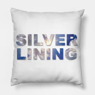 Silver Lining text with clouds and sun burst showing through the text. Pillow