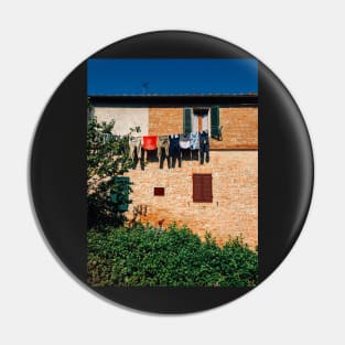 Laundry Drying on Washing Line Against Old Brick Building in Tuscany Italy Pin