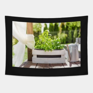 White wooden pot with green herbs on a wooden terrace Tapestry