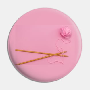 Pink knitting wool and bamboo knitting needles Pin