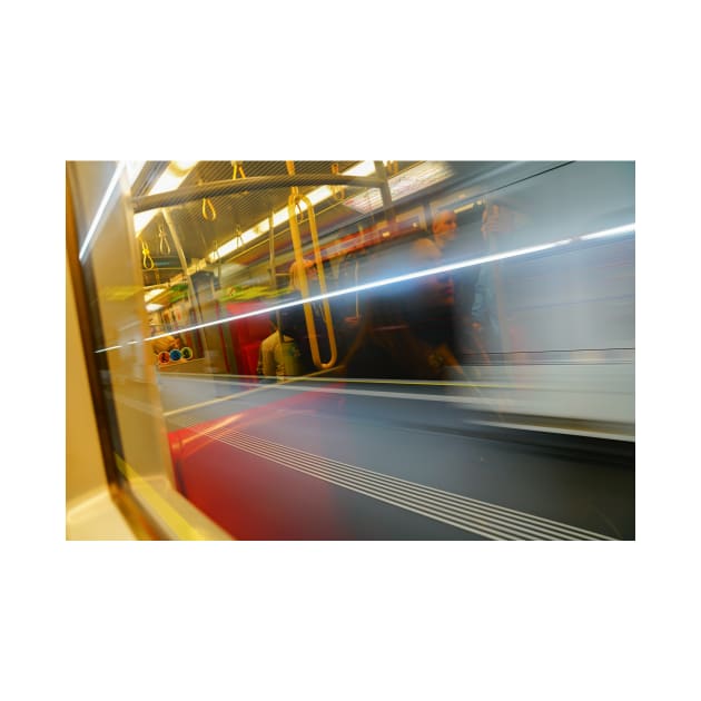 Commuters or passengers blurred in motion through window of passing train by brians101