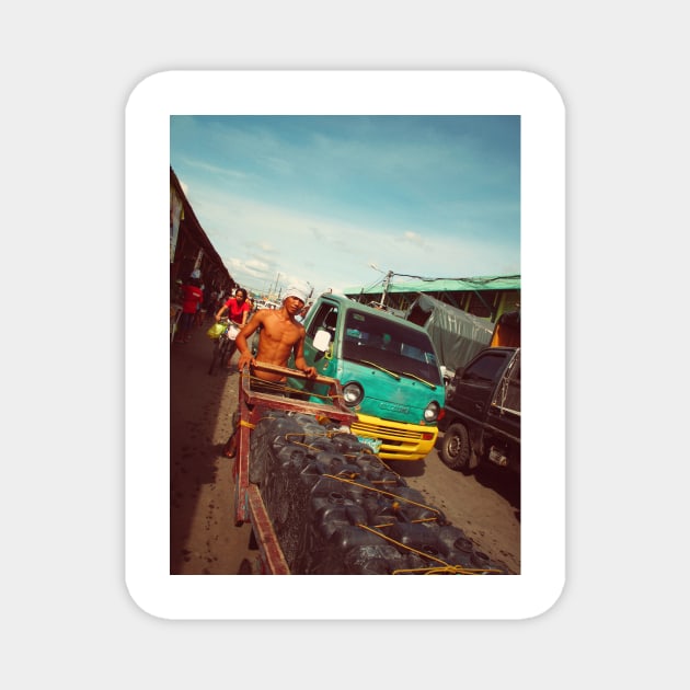 Filipino worker on a street market, Cebu city, Philippines. Magnet by Nalidsa