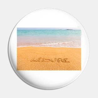 Inscription "LEISURE" made on beautiful beach by the blue sea Pin