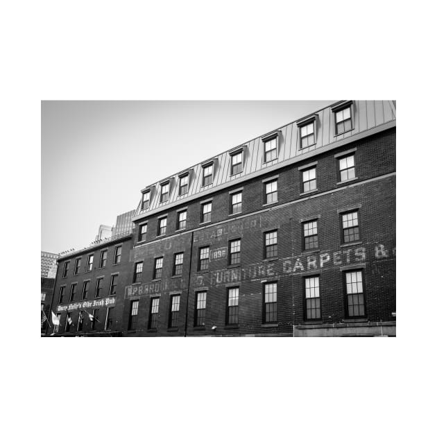 Old brick Boston Buildings with faded aged signage by brians101