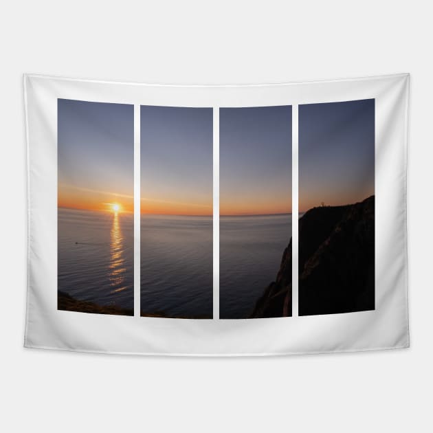 Wonderful landscapes in Norway. Nord-Norge. Beautiful scenery of a midnight sun sunset at Nordkapp (Cape North). Boat and globe on a cliff. Rippled sea and clear orange sky. Tapestry by fabbroni-art