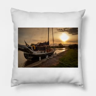 at sunset an old sailboat at the dock in Söderköping, Göta Canal in Sweden Pillow