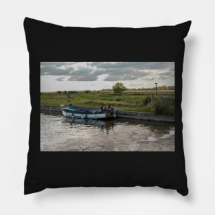 Small wooden pleasure boat moored in Thurne Dyke Pillow