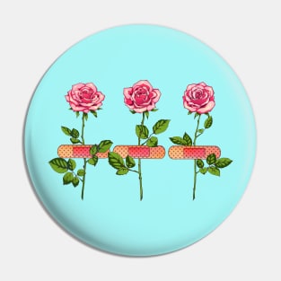 Pink roses with bandage plasters Pin