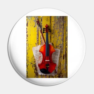 Baroque Violin Hanging On Yellow Wall Pin