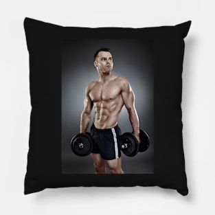 Young athletic man holding two heavy dumbbells Pillow