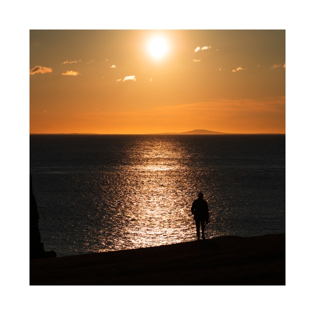 Silhoutte of a Man Watching Sunset by the Sea in Scotland by Danny Wanders