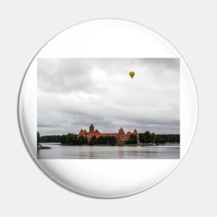 Yellow air balloon over red Castle Pin