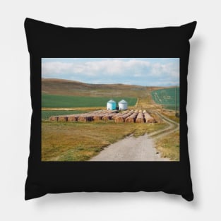 Grain silo with crop wheat rolls in Alberta. Canadian prairie landscape in autumn season. Pillow