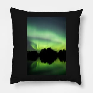 Northern lights glowing over lake in Finland Pillow
