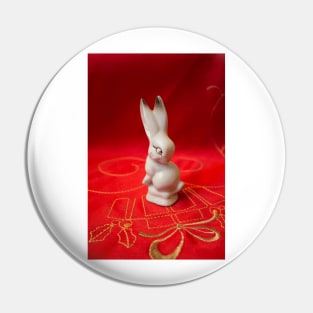 White bunny on red background Pin