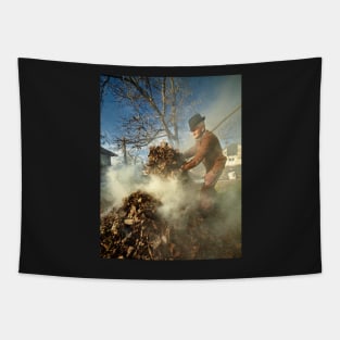 Old farmer burning dead leaves Tapestry