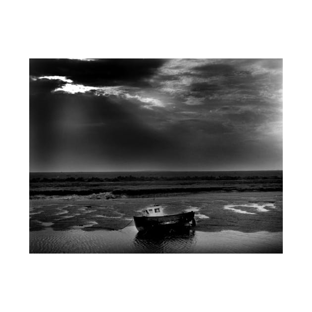 Fishing boat at low tide at Burnham Overy Staithe, Norfolk, UK by richflintphoto