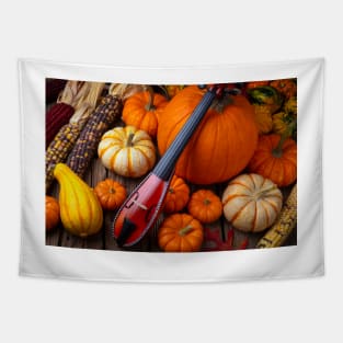 Pocket Violiv Among Autumn Harvest Tapestry