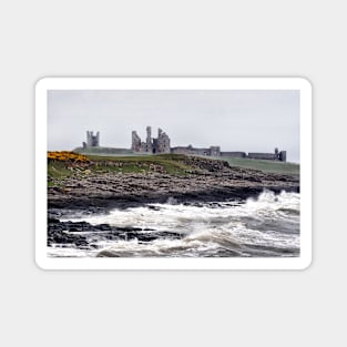 Rough waves battering the coast near Dustanburgh castle Northumberland, UK Magnet