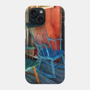 Blue and Green Rocking Chairs Against Red Door Phone Case