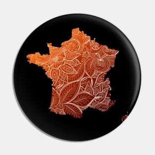 Colorful mandala art map of France with text in brown and orange Pin