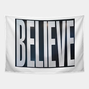 Believe, white lettering on black. Tapestry