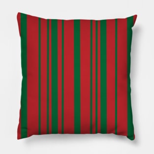 Green Stripes Standing in Front of Red Pillow