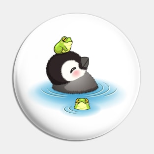 Happy emperor penguin chick with frog Pin