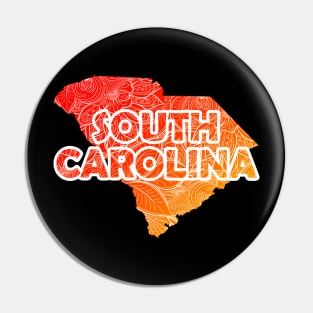 Colorful mandala art map of South Carolina with text in red and orange Pin