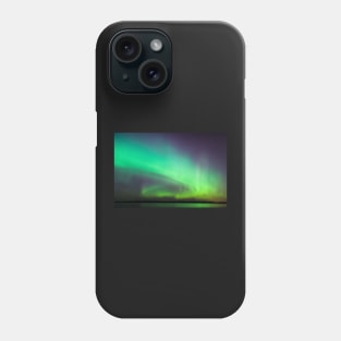 Northern lights over lake in Finland Phone Case