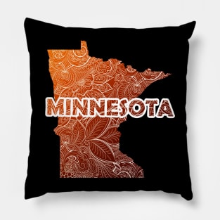 Colorful mandala art map of Minnesota with text in brown and orange Pillow