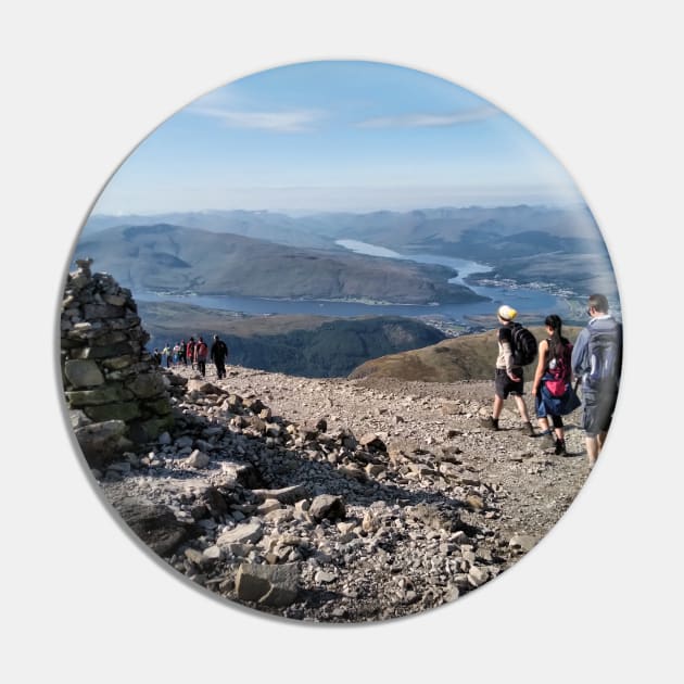 Hikers pass a navigation cairn as they descend back down Ben Nevis Pin by richflintphoto