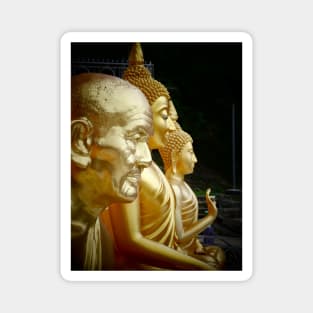 3 Buddhas seated, Thailand. One depicted as an old man. Magnet