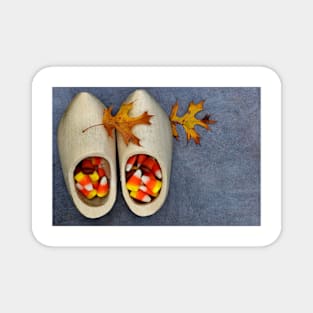 Wooden Dutch shoes with candy corn and oak leaves. Magnet