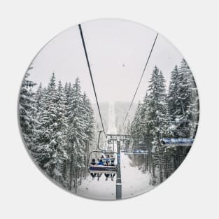 cable car through snowy forest Pin