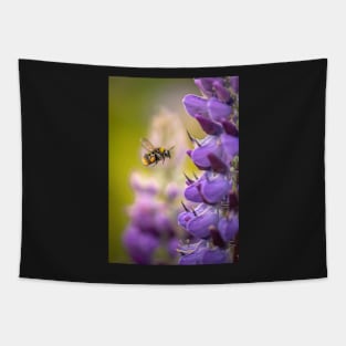 Bumblebee in Flight with Purple Lupin Flowers Tapestry