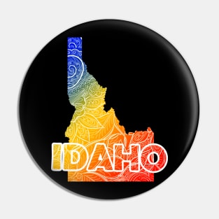 Colorful mandala art map of Idaho with text in blue, yellow, and red Pin