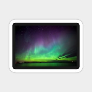 Beautiful northern lights over lake in Finland Magnet