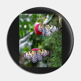 Two butterflies on red balls Pin