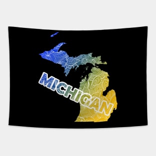 Colorful mandala art map of Michigan with text in blue and yellow Tapestry