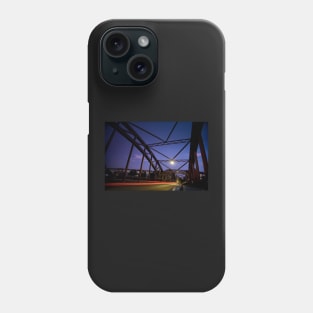 Perspective of an iron bridge with car light trails at twilight in Berlin, Germany Phone Case