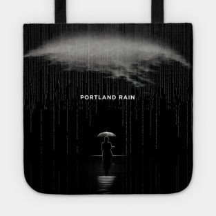 Portland Oregon Winter Rain: A person isolated under an umbrella in the pouring rain on a Dark Background Tote