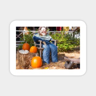 Halloween Mannequin in with ugly mask chair outside beside three large orange pumpkins Magnet