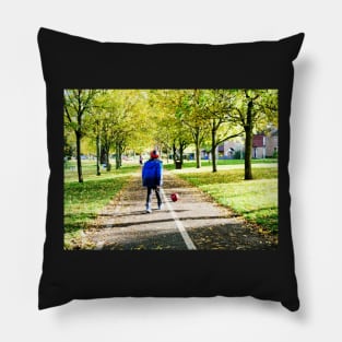 Boy playing football in autumn Pillow