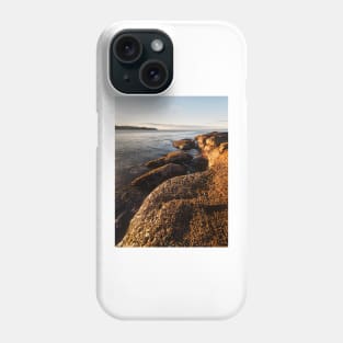 Early morning light on the rocks Phone Case
