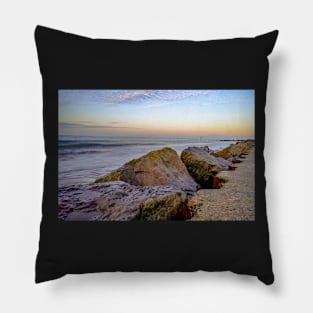 Close up of rocks and boulders protecting the cliffs on the Norfolk coast Pillow