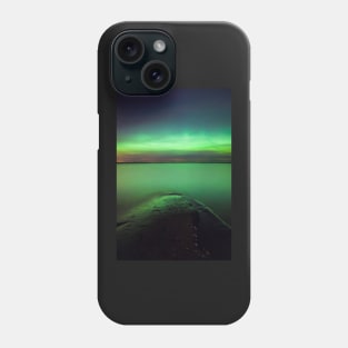 Northern lights glow over lake Phone Case