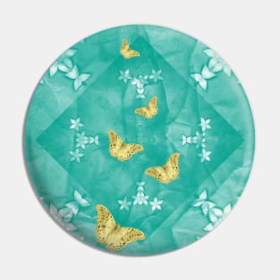 Gold butterflies and silver flowers on a textured teal mandala Pin